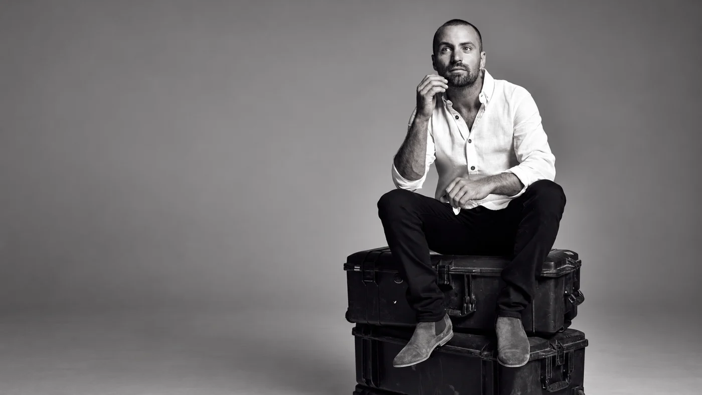 Tim Noonan, seated black-and-white studio portrait